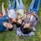 happy-family-sleeping-grass